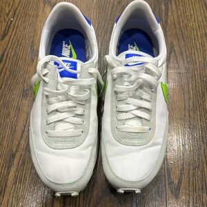Green and white Nike
